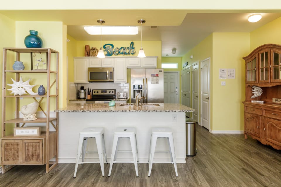 Your bright kitchen features granite countertops, modern appliances, and a breakfast bar where you can sip morning coffee.