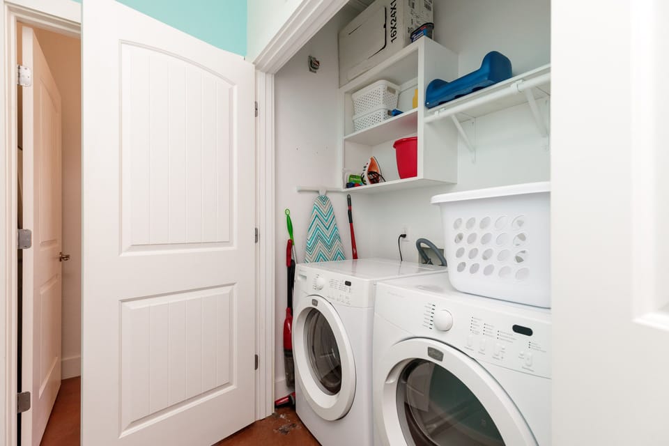 Your dedicated laundry room keeps your vacation wardrobe fresh with a full-size washer and dryer, plus organized shelving for all your essentials.