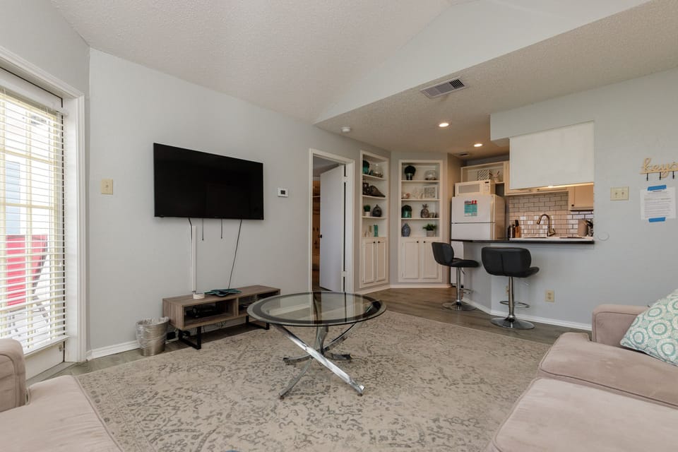 Unwind in your open-concept living space where modern comfort meets convenience. Watch your favorite shows while breakfast sizzles nearby.