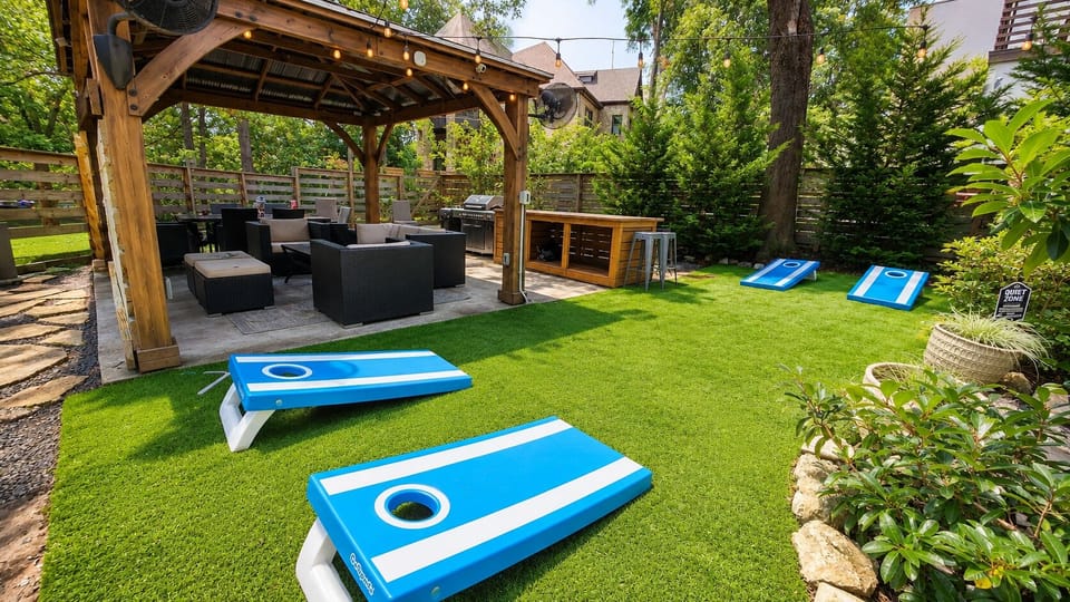 Resort Style Backyard
• Covered gazebo with 65" Smart TV and fans
• Outdoor Bar with Seating for 6 and mini-beverage refrigerator
• Gas grill
• Outdoor dining table with seating for 6
• Multiple lounge areas
• Cornhole, Giant Jenga, and outdoor games