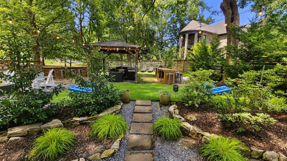 Resort Style Backyard
• Covered gazebo with 65" Smart TV and fans
• Outdoor Bar with Seating for 6 and mini-beverage refrigerator
• Gas grill
• Outdoor dining table with seating for 6
• Multiple lounge areas
• Cornhole, Giant Jenga, and outdoor games