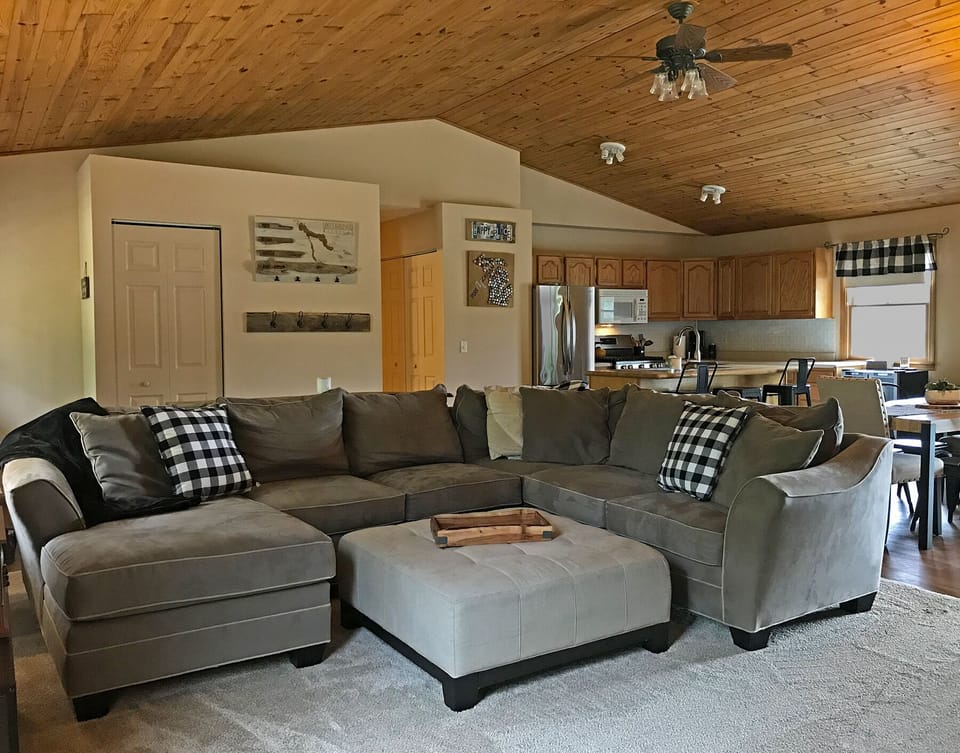 Spacious living room with vaulted ceiling. 