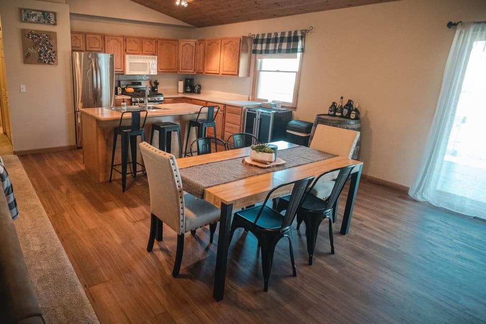 Open concept dining room, kitchen, and living room. 