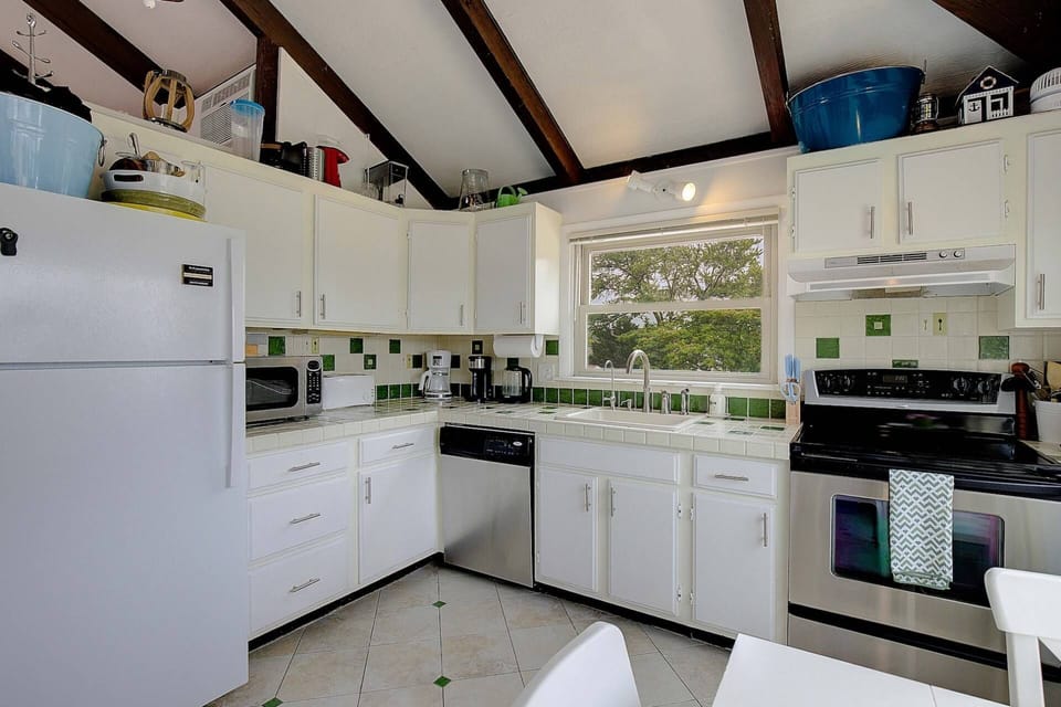 The kitchen is fully-stocked with all the major appliances and cookware to make a family meal.