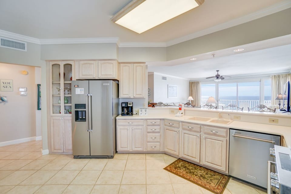 Your spacious kitchen welcomes you with gleaming appliances, abundant storage, and an open connection to the bright living area beyond.
