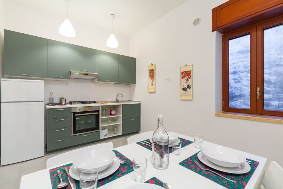 Deluxe Apartment | Private kitchen | Coffee/tea maker, electric kettle, toaster, freezer