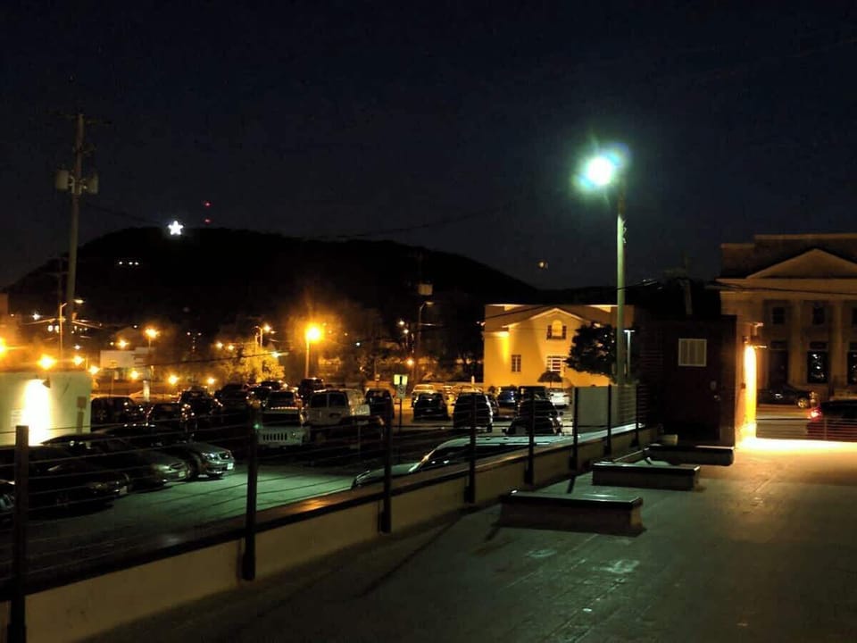 Night view of Mill Mountain Star nearby