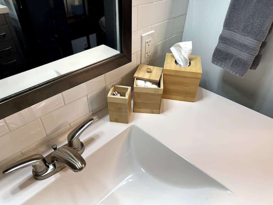Bathroom sink with mirror and daily essentials