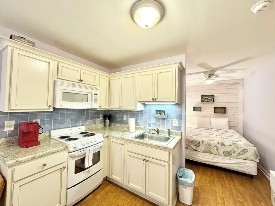 Kitchen area/queen size bed.