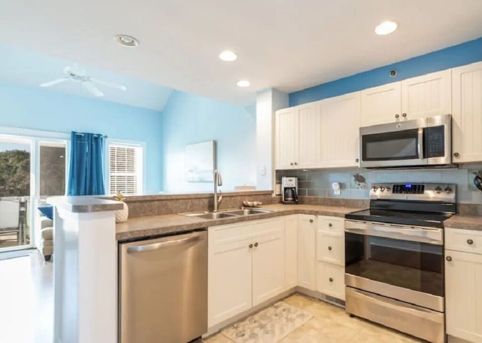 Open concept kitchen next to living area