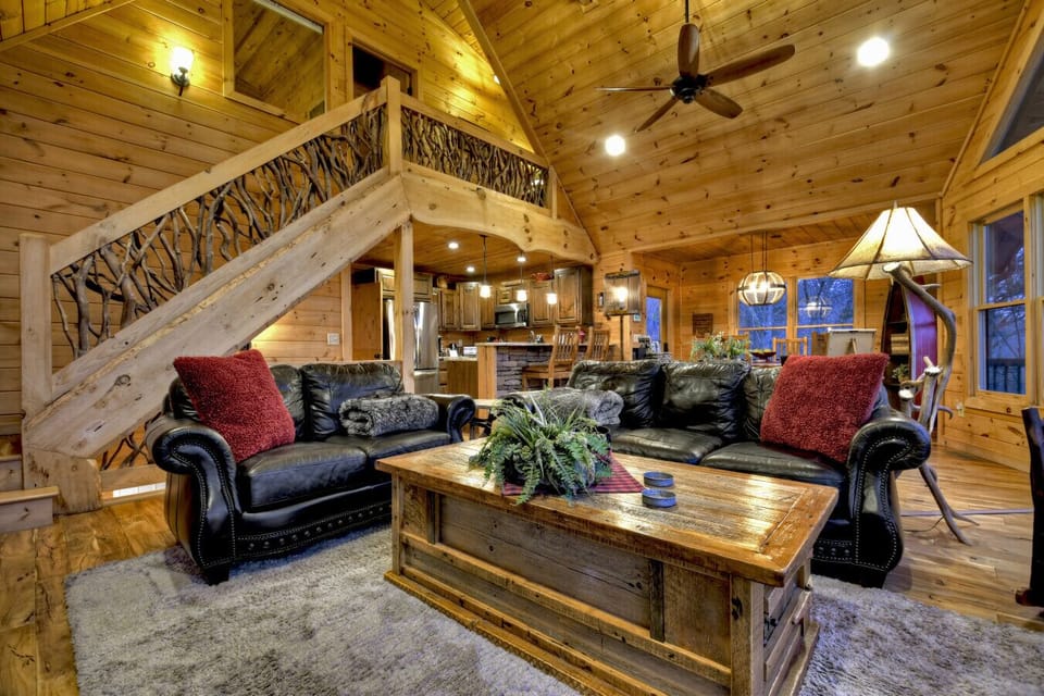 Living room with comfortable upscale furnishings and spectacular mountain views.