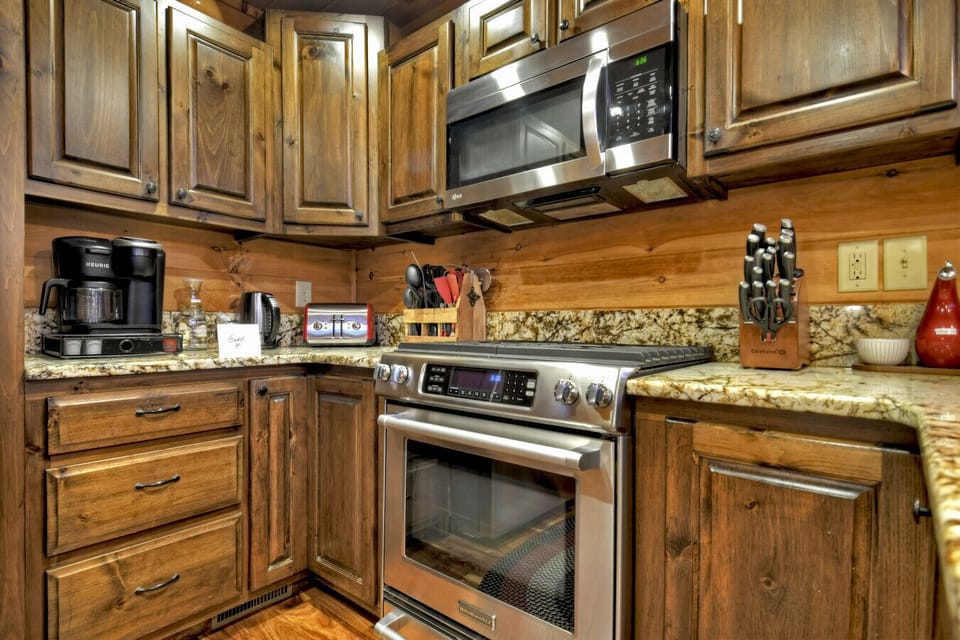 Well stocked kitchen with ample counter top space.