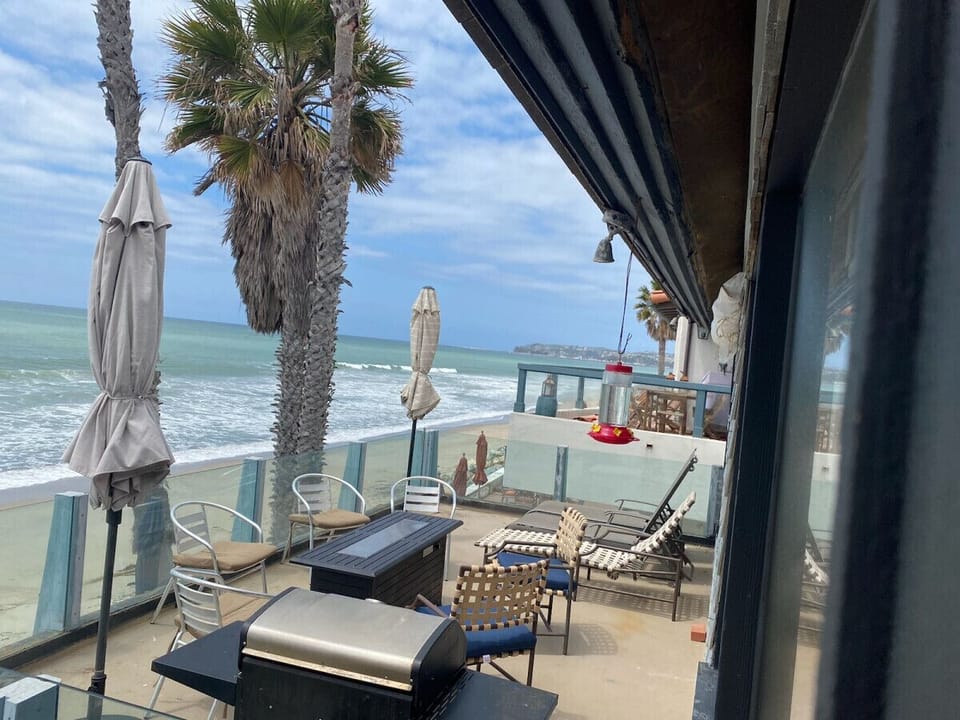 Upstairs desk - includes bbq, 6 chairs, and two lounges