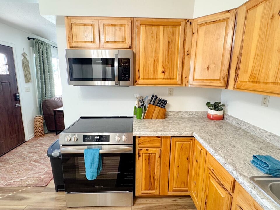 New appliances and fully stocked kitchen for cooking meals!