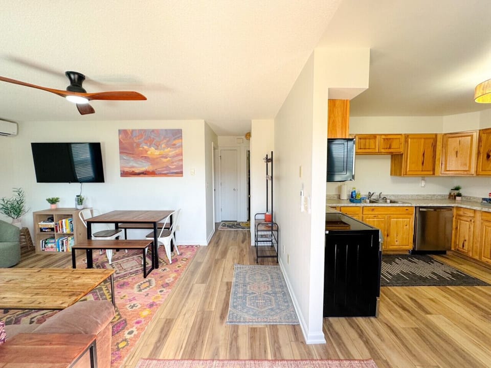 View from front door with open kitchen, living, dining layout