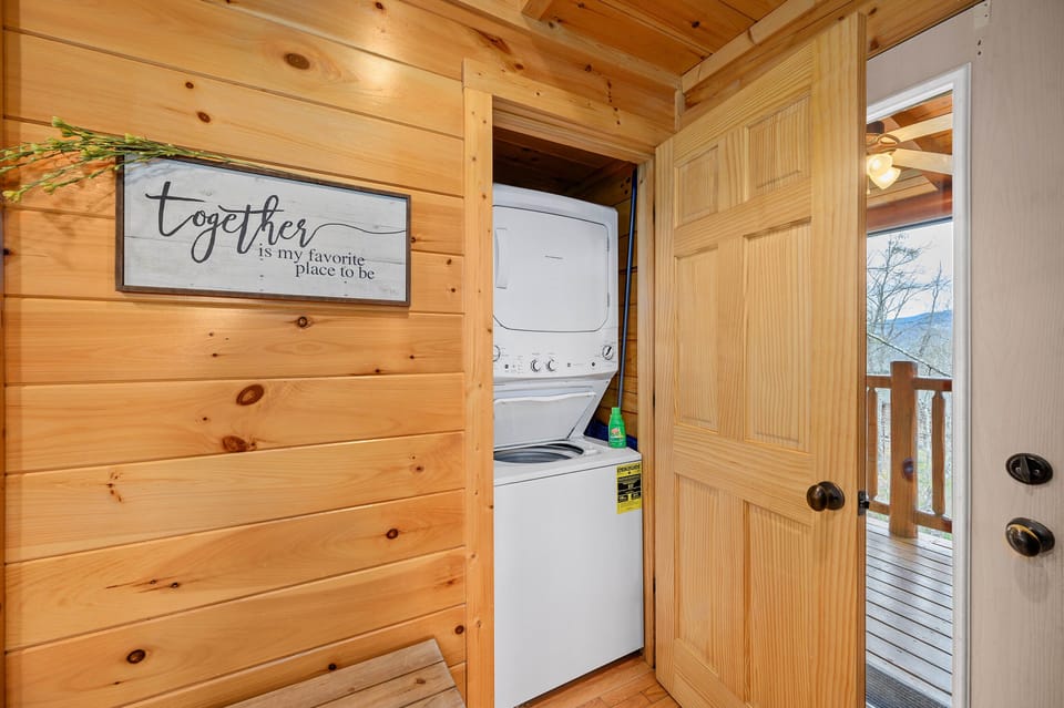 Washer and dryer set, complete with a starter-size bottle of laundry detergent.