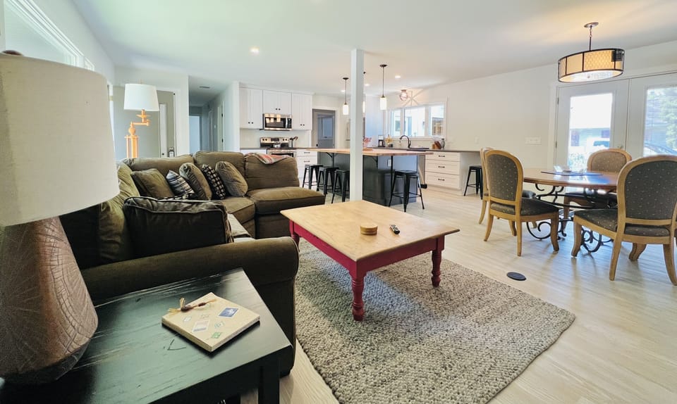 Open floor plan with spacious kitchen, living and dining spaces.