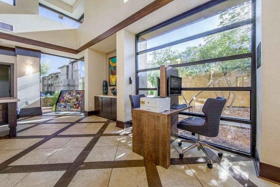 Work or unwind in a bright, airy common area, featuring modern furnishings and inviting natural light.