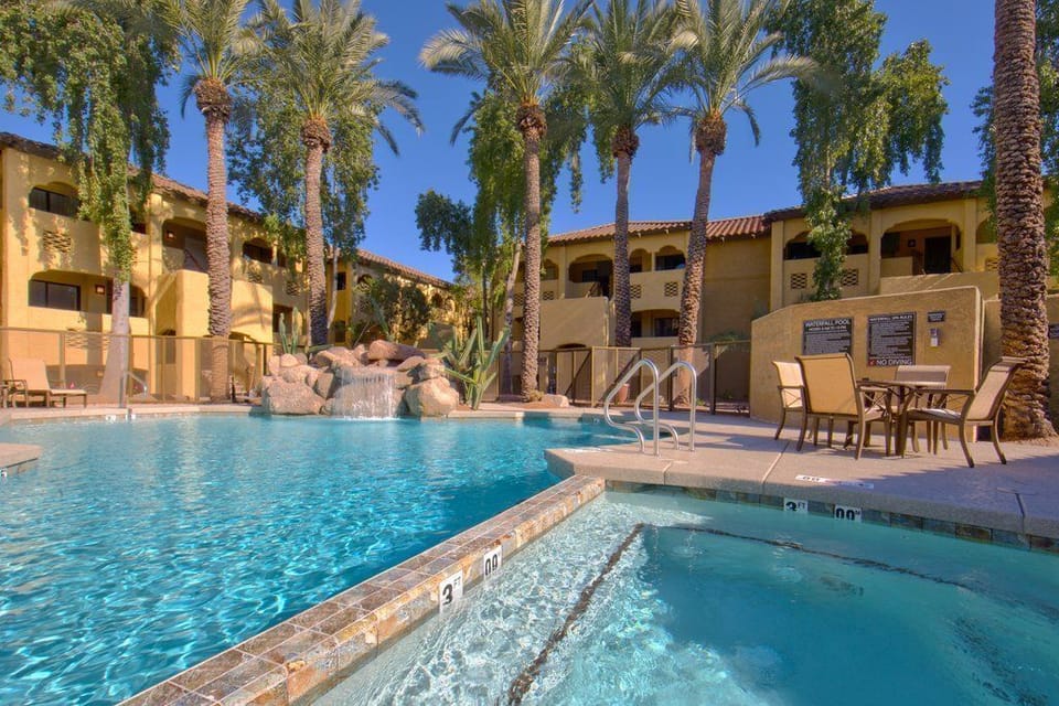 Enjoy a refreshing dip in the heated pool, with rock features and lounge chairs perfect for sunbathing.