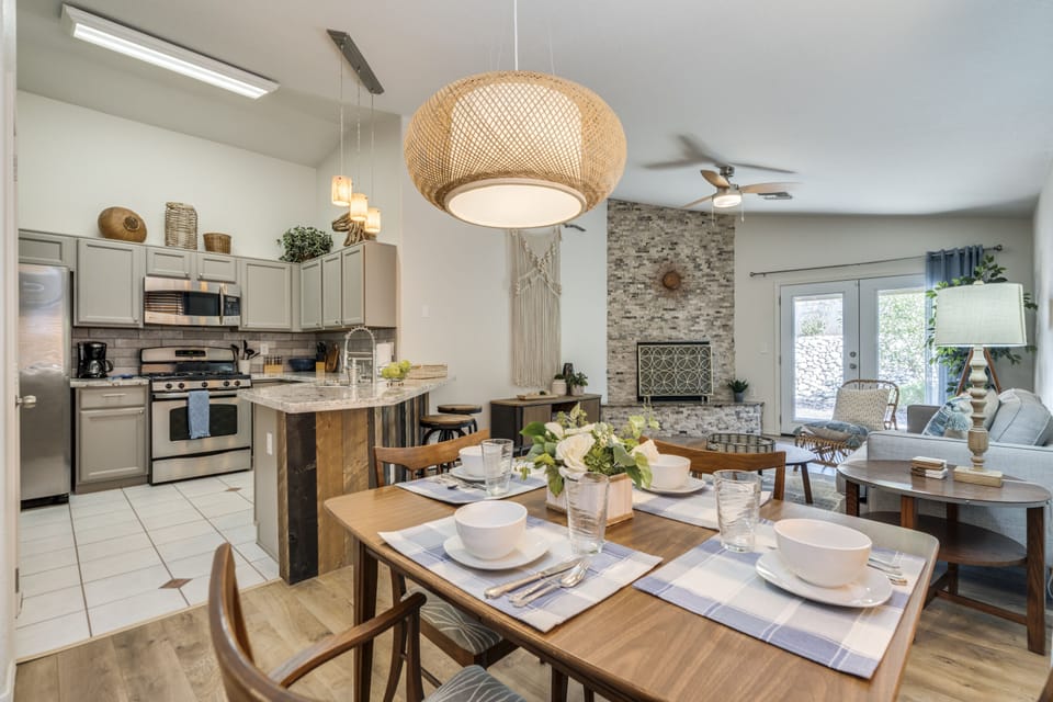 Cozy dining area open to living room, kitchen and bartop