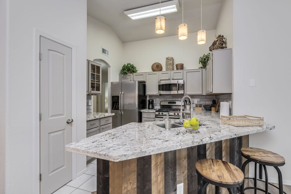Granite bartop to open kitchen