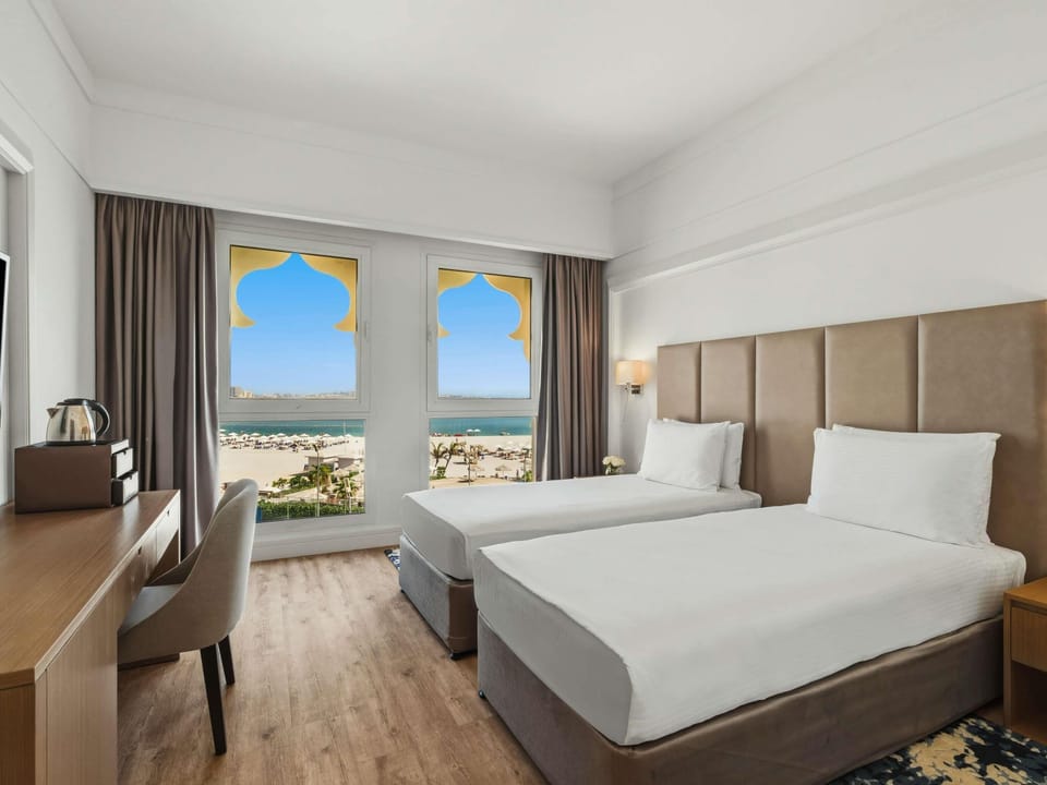 Deluxe Room, 2 Twin Beds, Sea View | Free minibar, in-room safe, desk, free WiFi