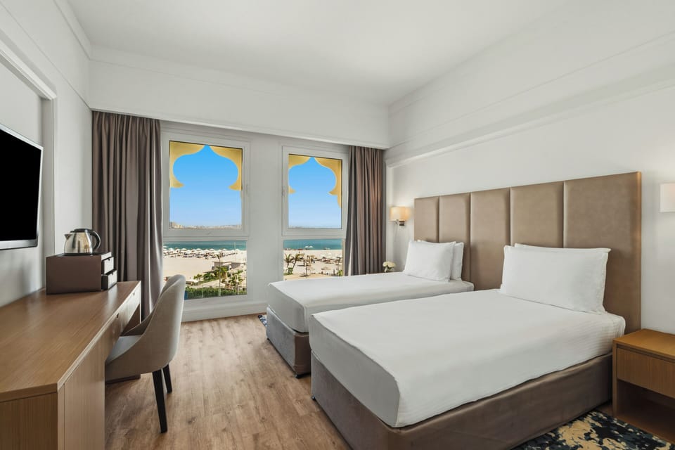 Deluxe Room, 2 Twin Beds, Sea View | Free minibar, in-room safe, desk, free WiFi