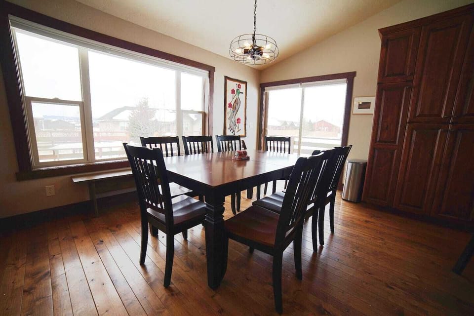 The dining room table can fold out to accommodate your entire party!