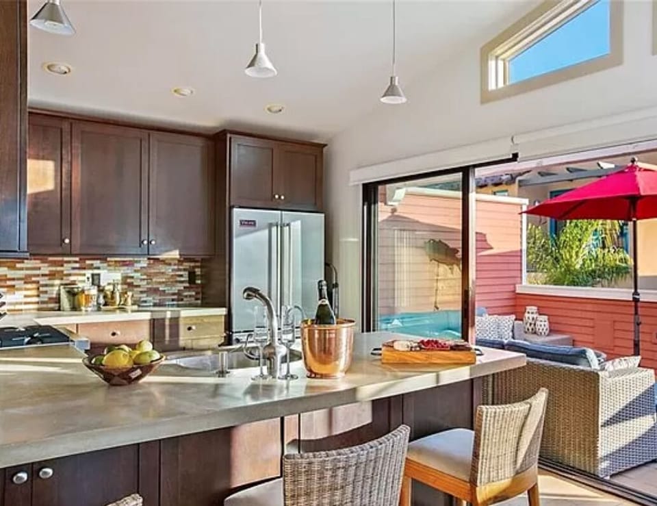 Entertaining is a must in this stocked kitchen with Viking appliances. Barstool seating ensures no one is left out of the kitchen conversation!