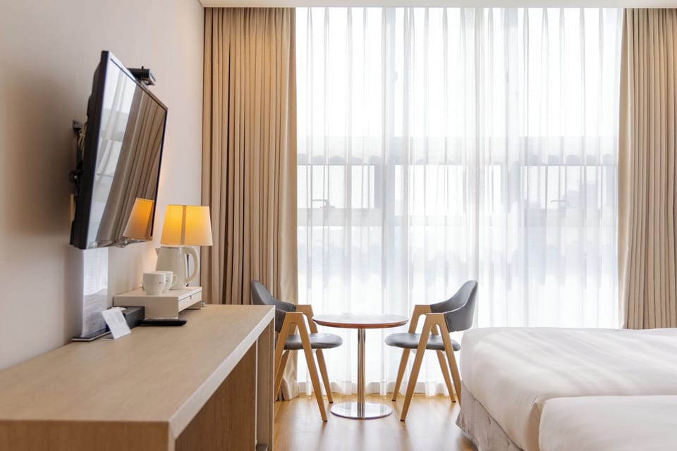 Family Twin Room | Down comforters, in-room safe, desk, blackout drapes