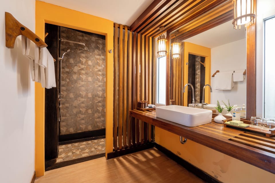 River View Deluxe | Bathroom | Shower, designer toiletries, hair dryer, bathrobes