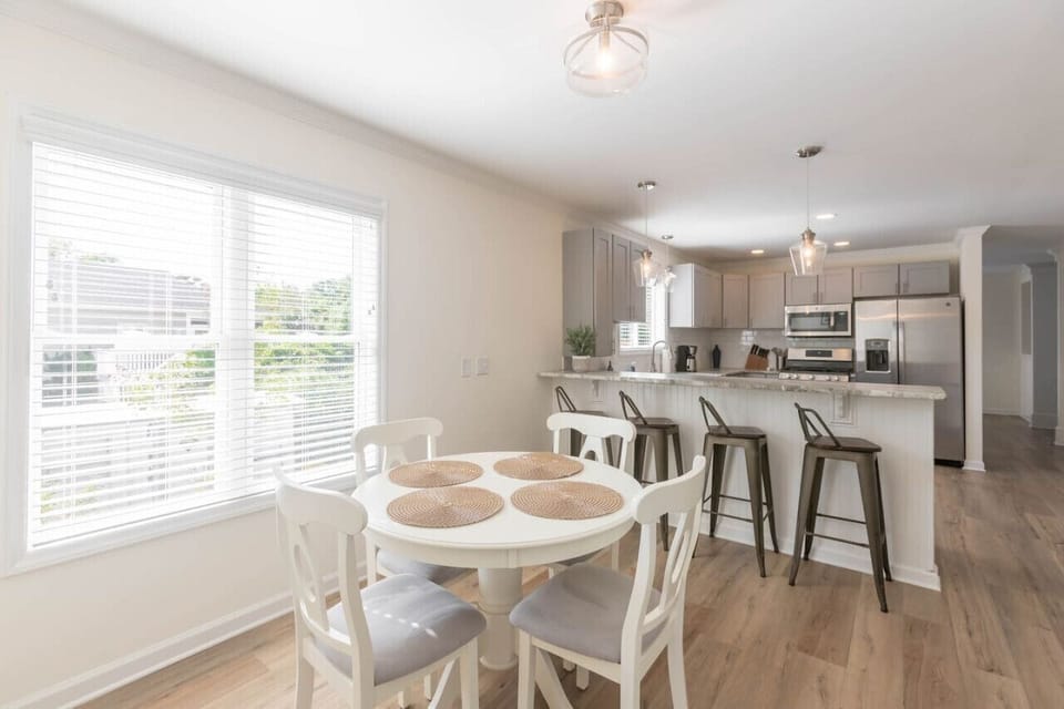 The large kitchen also has a small table and bar seating as well as a pantry to store all your groceries!