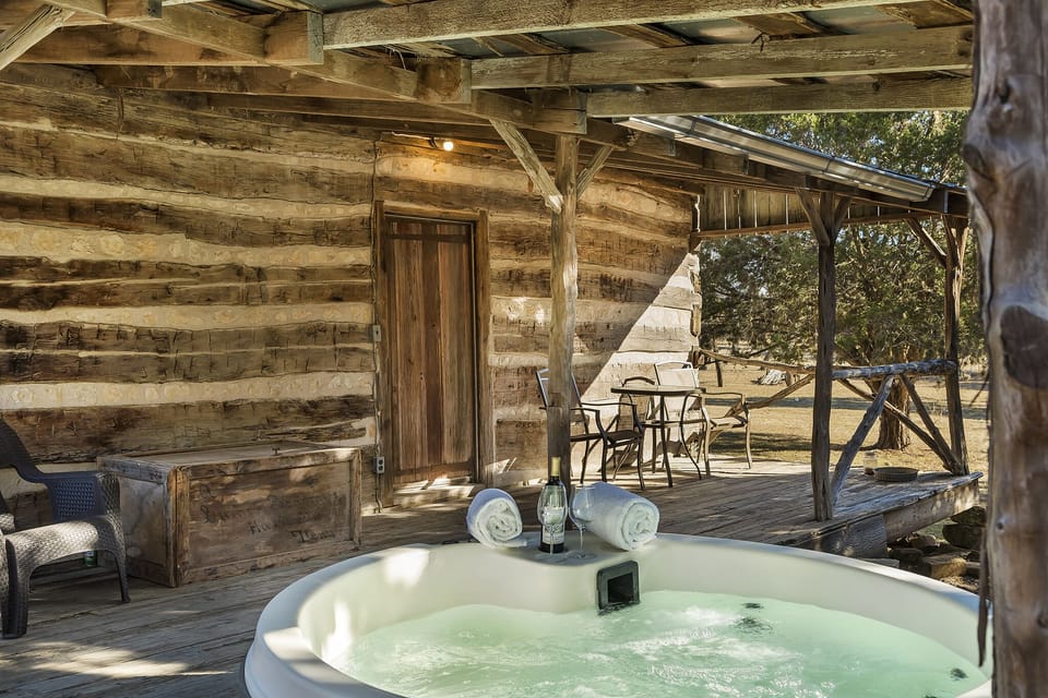 Relax in the hot tub with a glass of wine