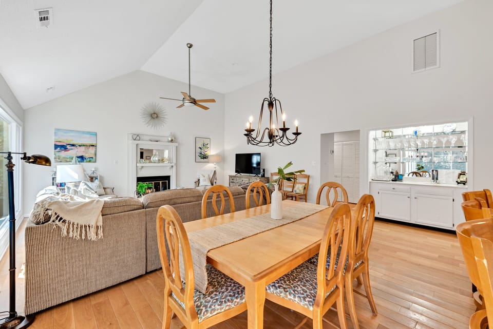 The dining room is adjacent to the living area and has a bar - perfect cocktail spot!!