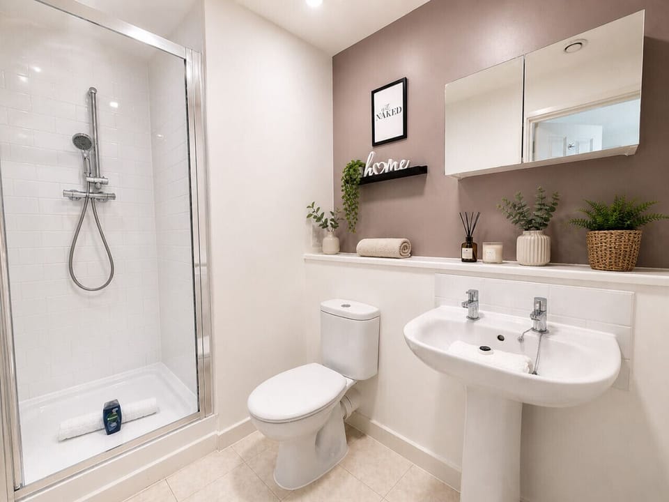 En-suite with a walk-in shower and complimentary toiletries provided.
