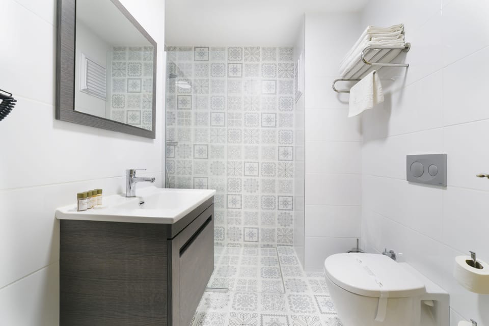 Family Room | Bathroom | Shower, slippers, towels