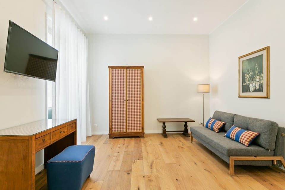 Apartment, 1 Bedroom | Living area | 21-inch flat-screen TV with digital channels, TV
