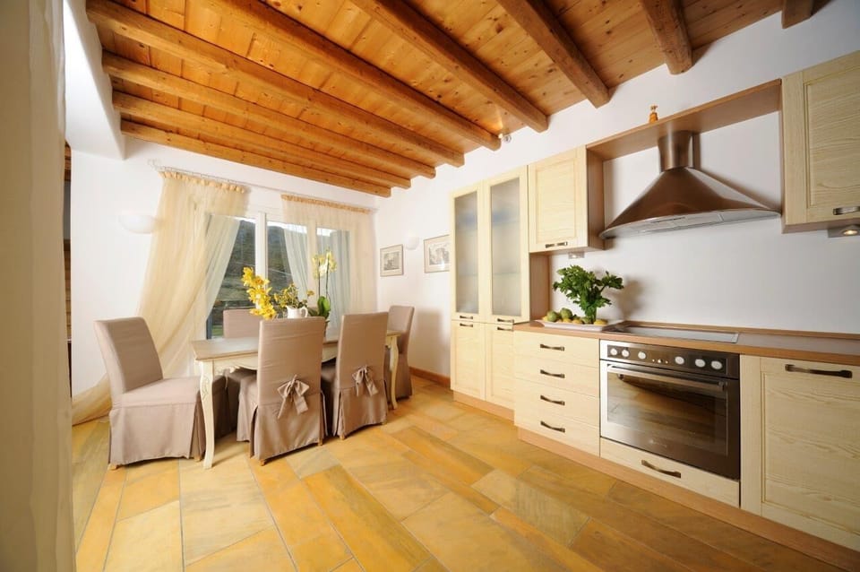 Fully equipped kitchen and dining area at villa Phivi