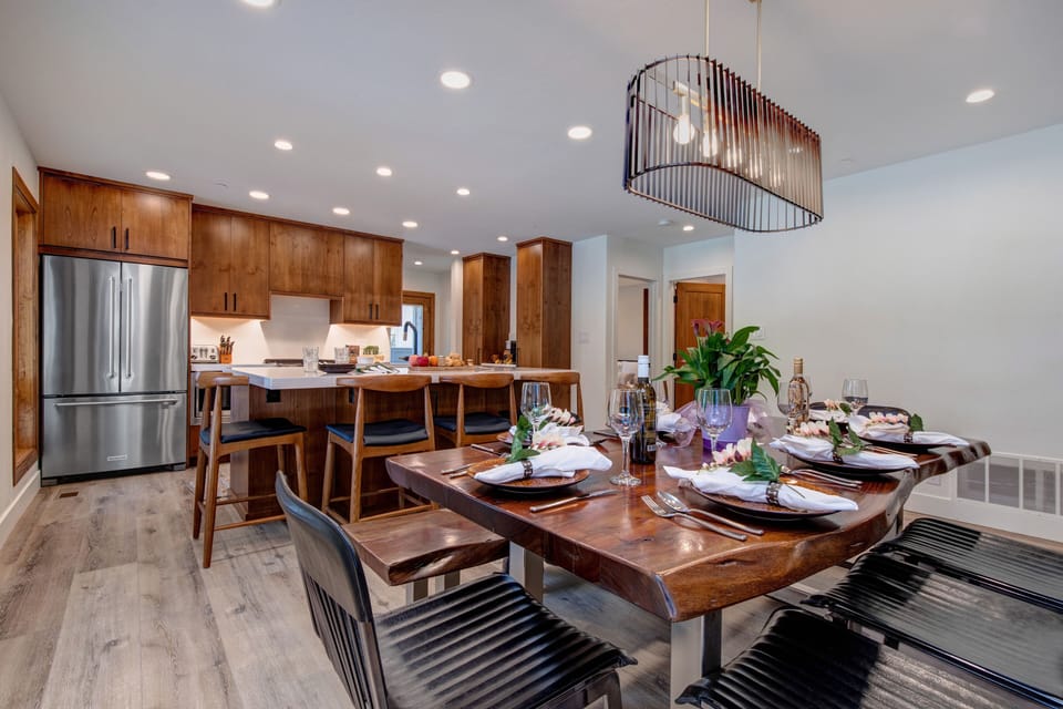 Fully equipped kitchen with new appliances, Log dining table with seating for eight, access to patio