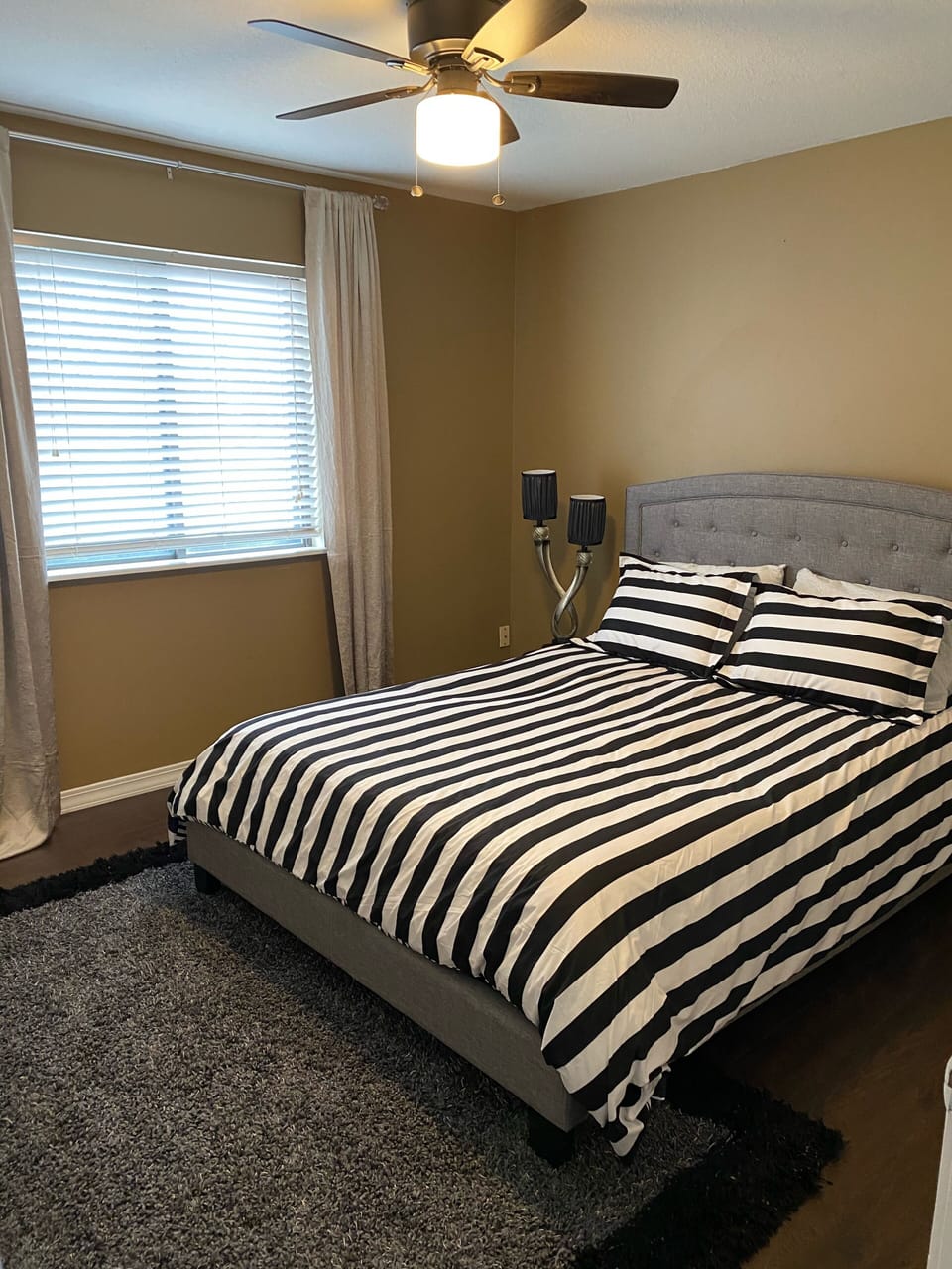 Guest bedroom with queen size bed. 