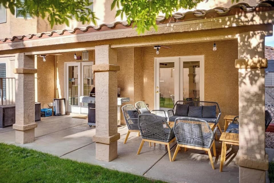 Spacious patio with barbecue grill, outdoor seating and privacy