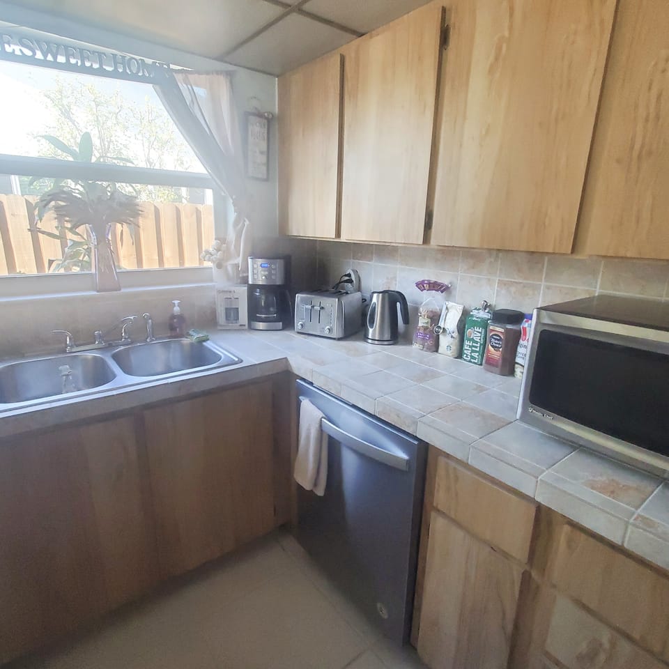 Kitchen have  coffee maker , big toaster, waffles maker , microwave, kettle