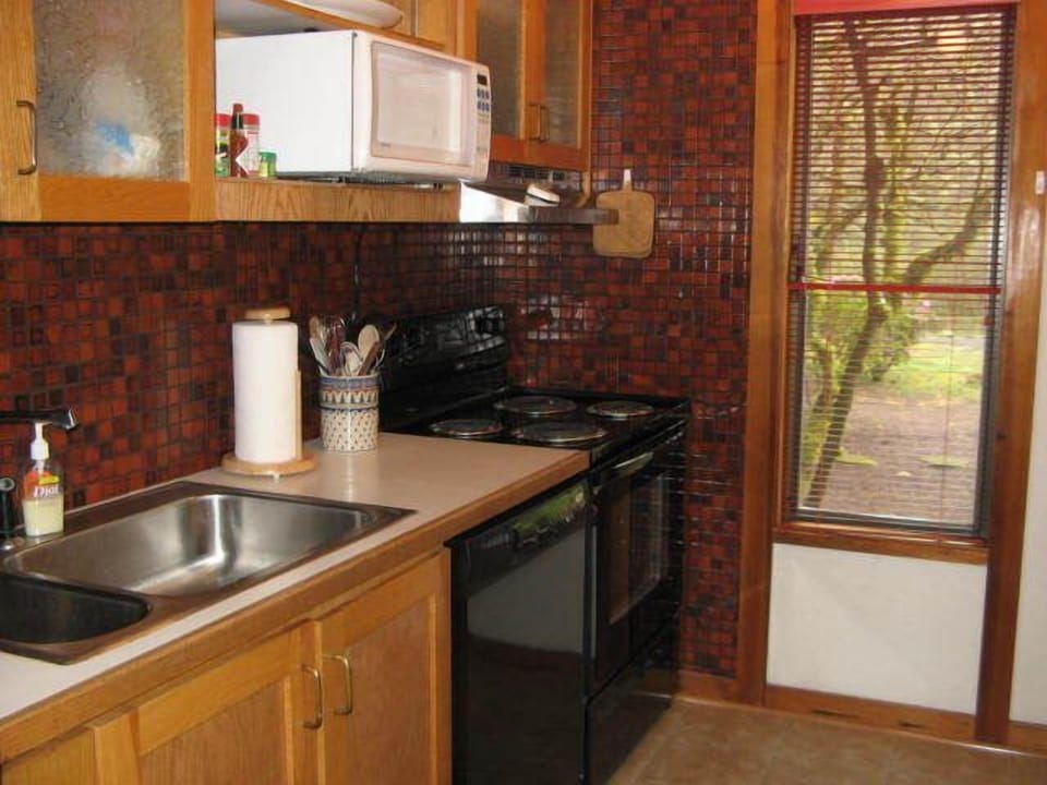 Kitchen - A full kitchen complete with all amenities needed to enjoy your stay comfortably.