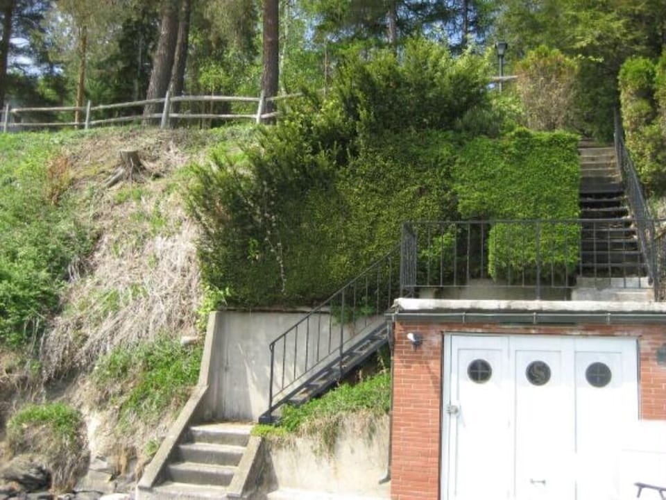 Boathouse, stairs leading up to the house/yard