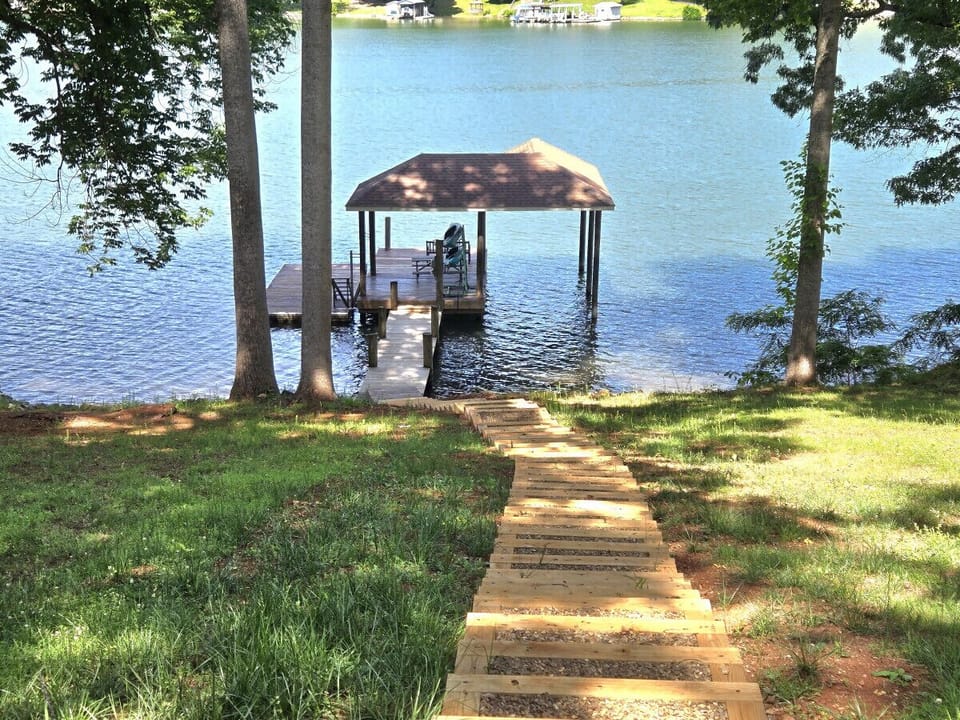 Adventure awaits with an aggressive, scenic path and many steps leading down to the lake.