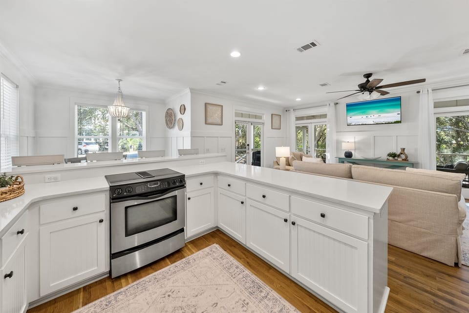 Your bright, open kitchen flows seamlessly into the living area, perfect for socializing while preparing meals in this beautifully appointed space.