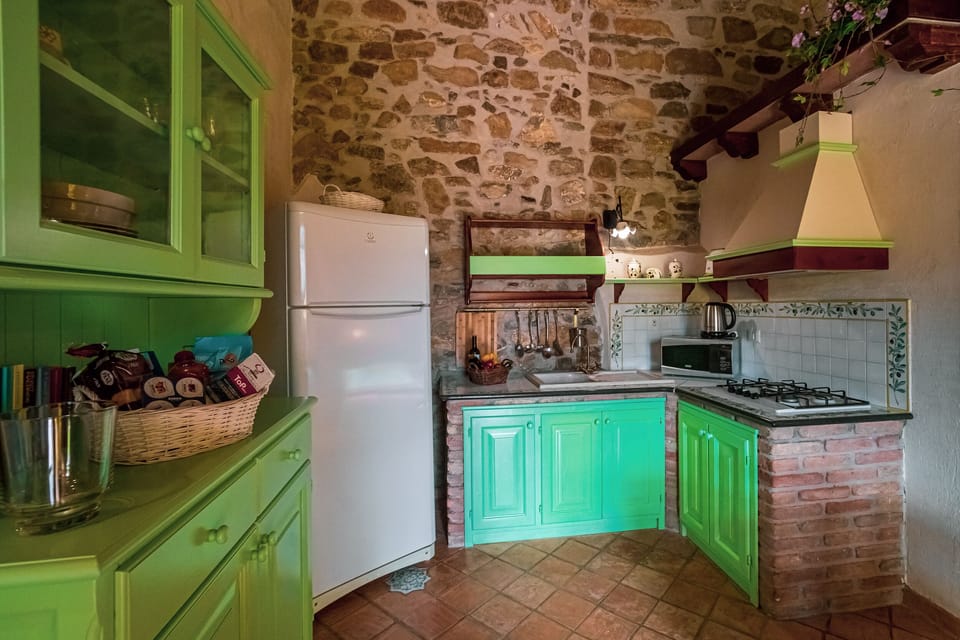 Full-size fridge, stovetop, electric kettle, toaster