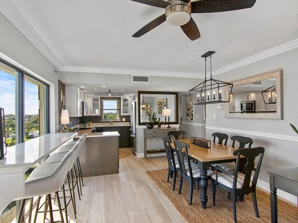 Dining area seats 6 plus 4 bar stools with ocean views.