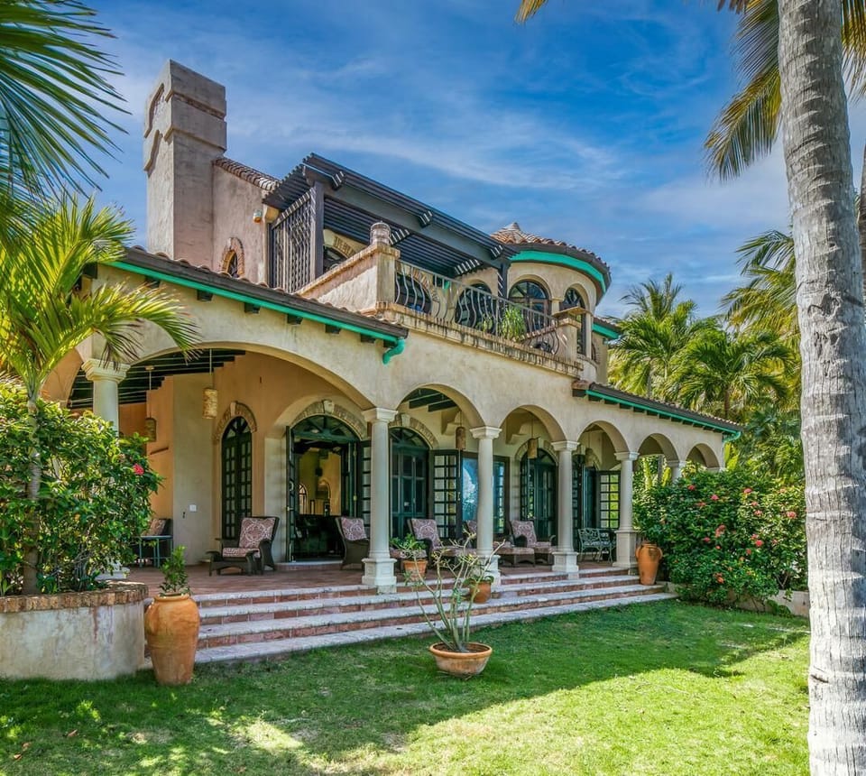 Front view of main house featuring LR, kitchen, dining room and MBR upstairs