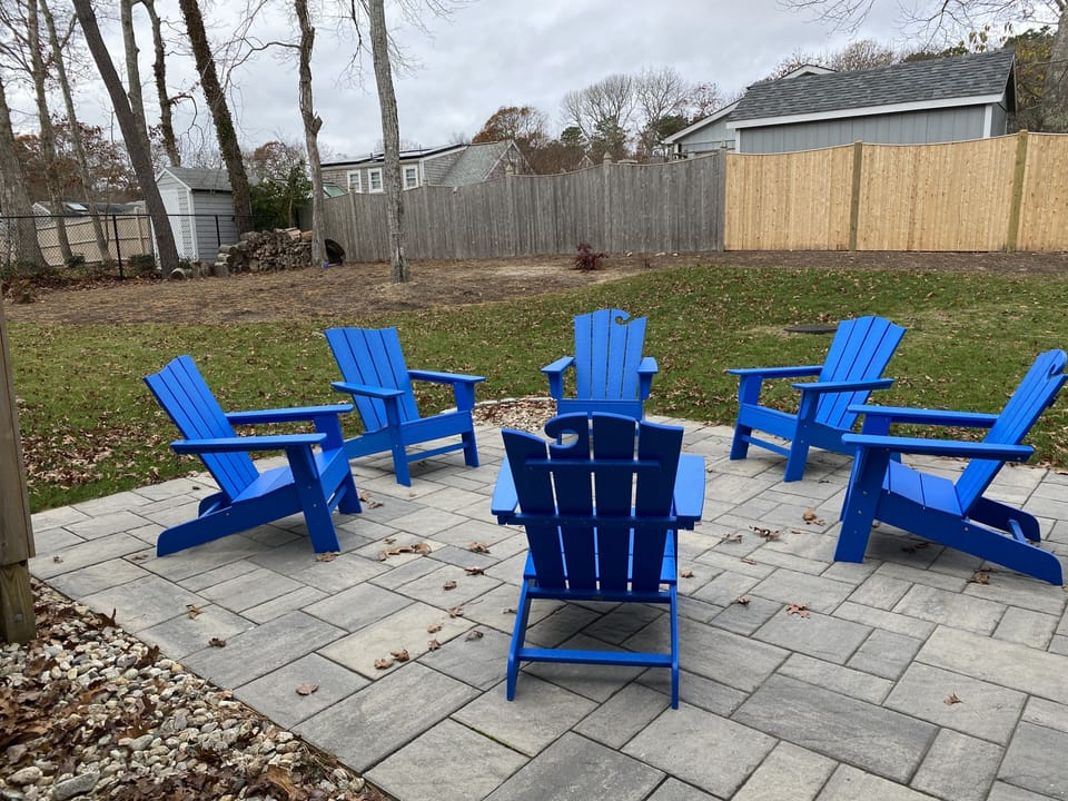 Adirondack chairs to relax by the fire pit.